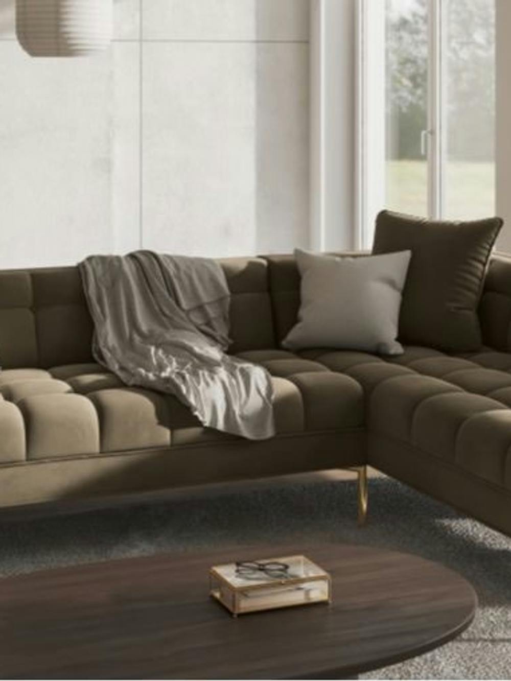 Luksusowa sofa z eleganckim obiciem z welwetu w kolorze szarym